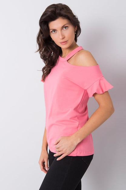 Stylish Off-Shoulder Cotton Blend Blouse with Short Sleeves, viewed from the side on a model, displaying the unique shoulder cut and short sleeves in a stylish setting.