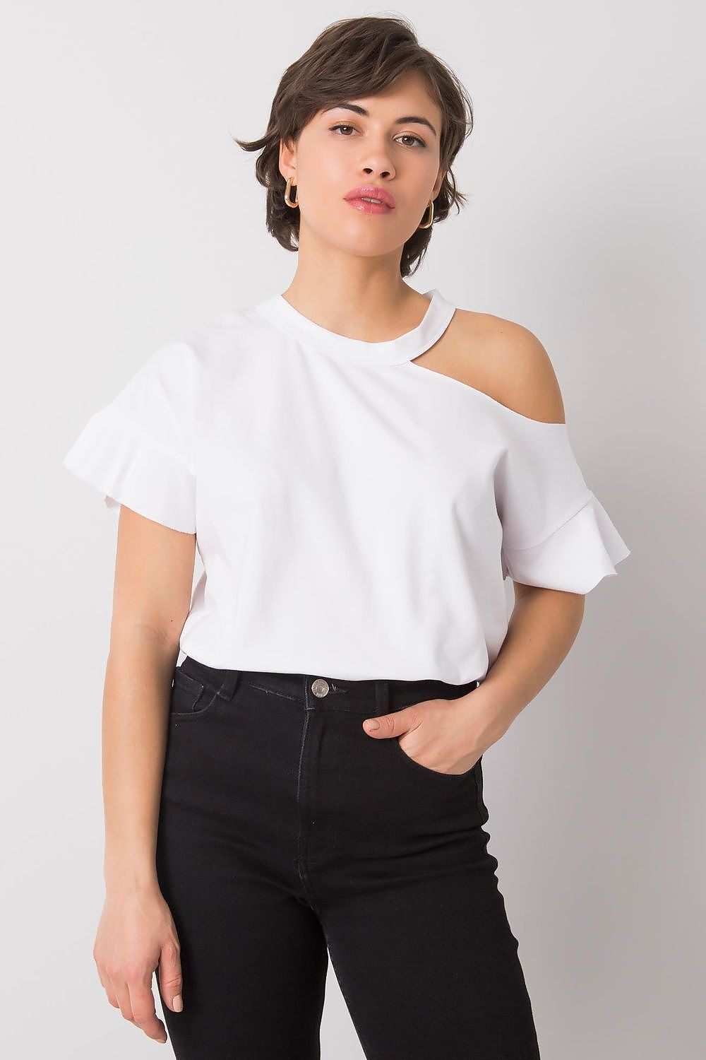 Chic front view of a model wearing a stylish off-shoulder cotton blend blouse with short sleeves in white, paired with black jeans, exuding a minimalist yet luxurious style.