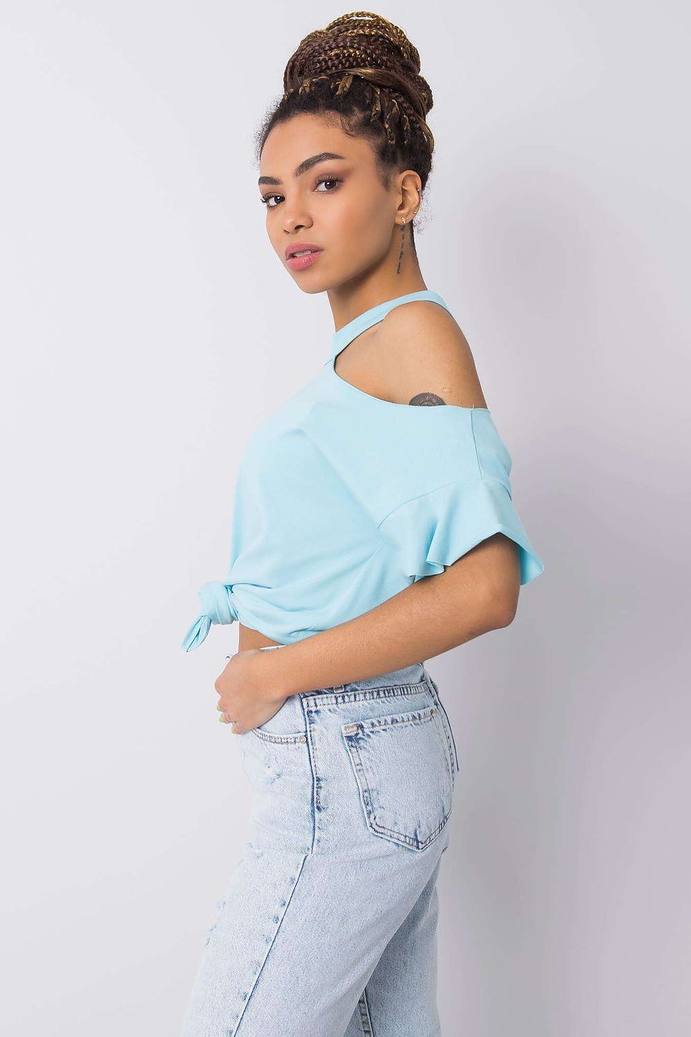 Stylish Off-Shoulder Cotton Blend Blouse with Short Sleeves displayed from the side, featuring a sophisticated cut that highlights the shoulder, paired with classic distressed blue jeans for an effortlessly trendy ensemble.