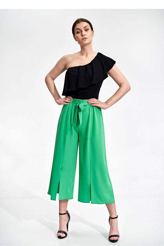 Luxury 7/8 Bell-Bottom Trousers for Women by Figl showcased in vibrant green with decorative slits, paired with a stylish black one-shoulder top.