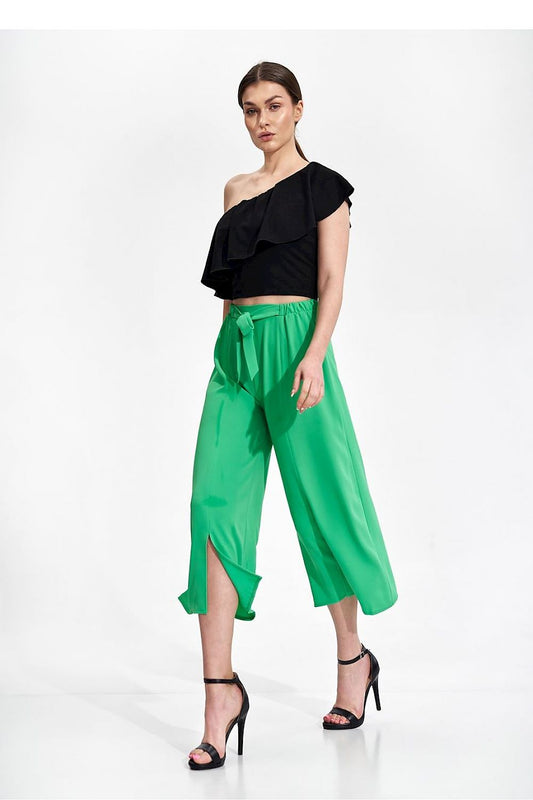 Elegant 7/8 Bell-Bottom Trousers for Women by Figl in striking green with front slits, styled with a chic black top for a luxurious look.