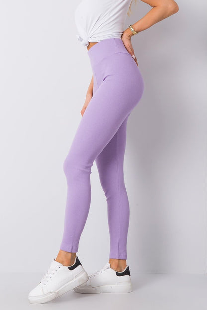 Sophisticated profile shot of the Elegant High-Waisted Ribbed Leggings for Women by BFG in refined lavender, complemented by a stylish white tee and modern trainer shoes.
