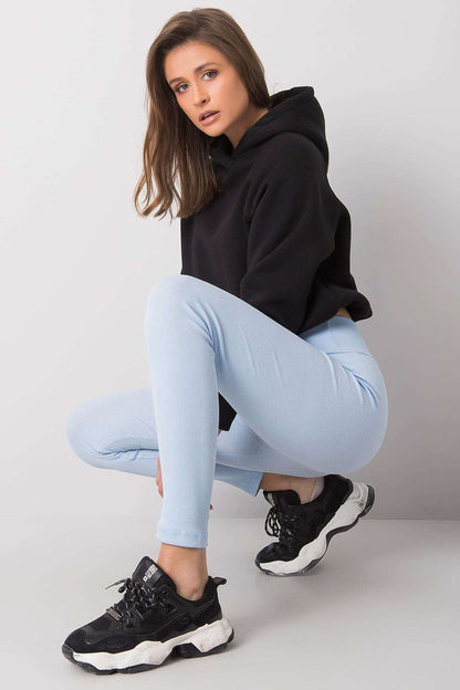 Elegant High-Waisted Ribbed Leggings for Women by BFG, showcasing a model in light blue leggings paired with a black oversized hoodie and stylish sneakers, exuding a chic yet relaxed vibe.