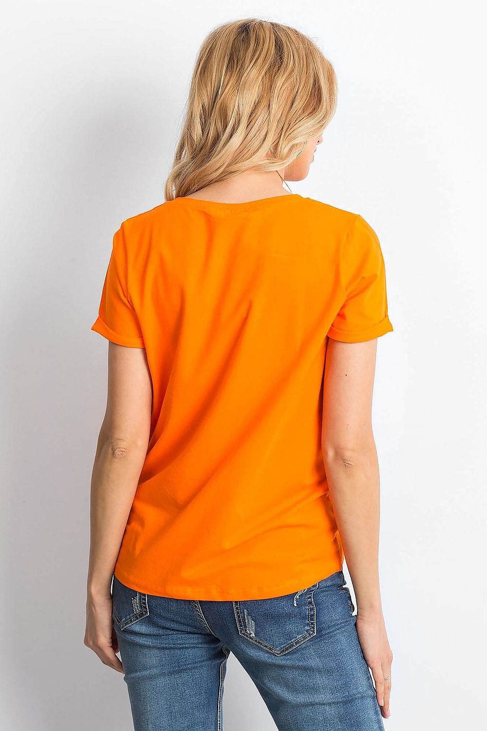 Back view of the Luxurious Ladies Cotton Spandex Short-Sleeved T-Shirt with Round Neckline, highlighting its sleek orange fabric and comfortable fit, worn by a fashionable blonde model.