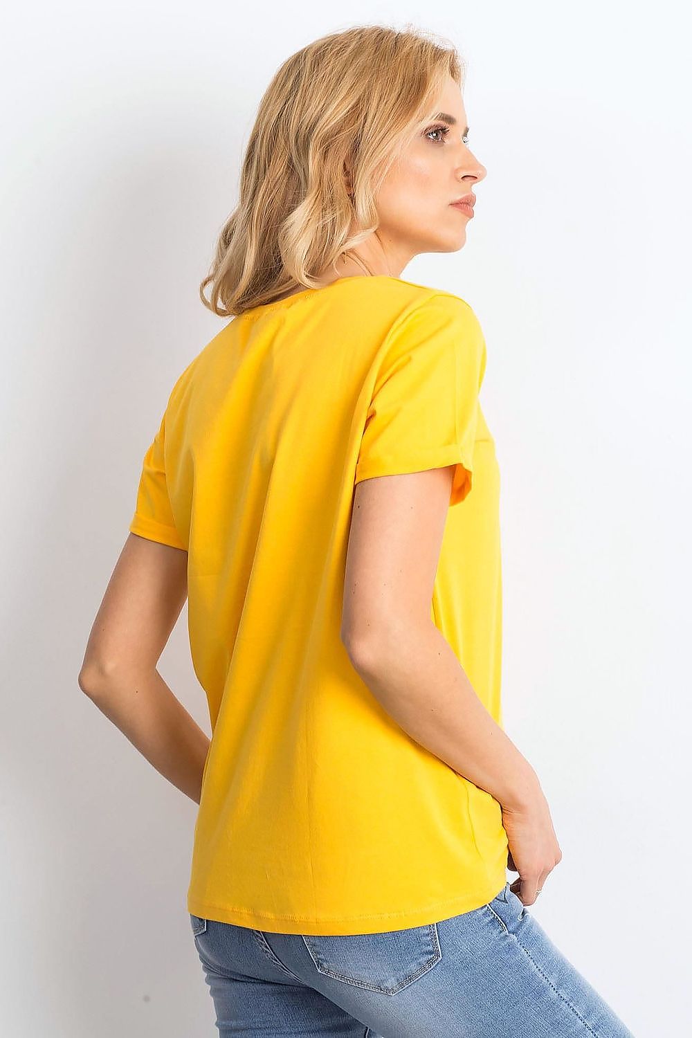 Luxurious Ladies Cotton Spandex Short-Sleeved T-Shirt with Round Neckline, featuring a side view of a model in a trendy yellow top, illustrating comfort and style for various occasions.