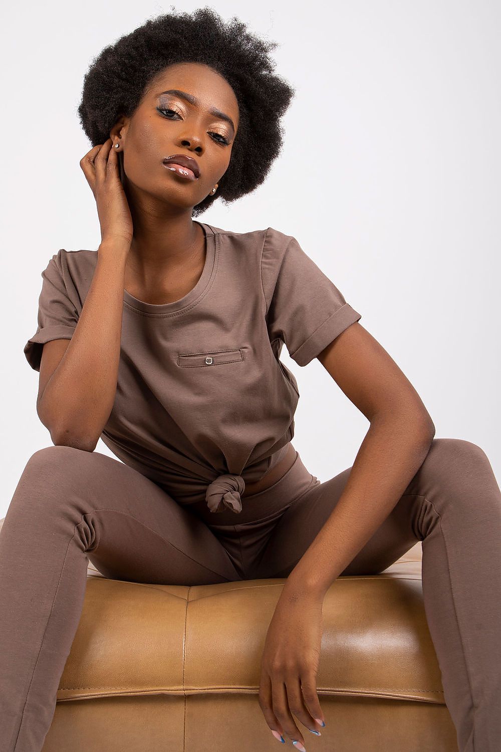 Elegant display of the Luxurious Ladies Cotton Spandex Short-Sleeved T-Shirt with Round Neckline in deep brown, featured with coordinating fitted bottoms for a trendy look.