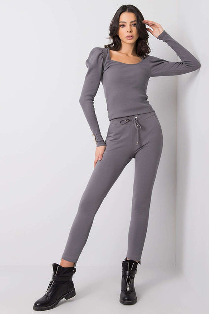 Elegant model showcasing BFG Luxury Tapered Sweatpants with Adjustable Waist and Side Pockets in grey. Perfect for casual luxury attire.