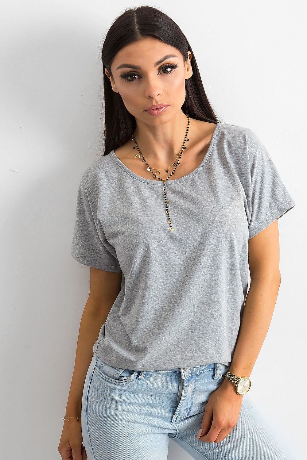 Elegant Ladies' T-Shirt by BFG displayed by a model, showcasing short sleeves, a round neckline, and a chic layered necklace, perfect for a stylish and comfortable look.