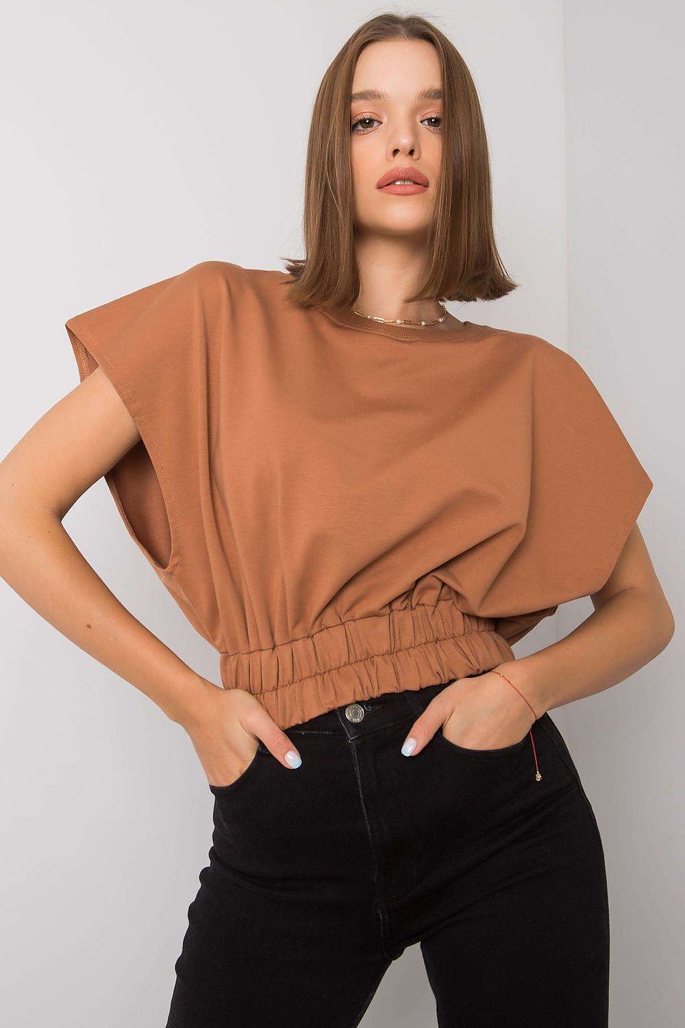 Luxury Ladies' Loose Fit Sweatshirt with Short Sleeves and Wide Rubber Band in a stylish brown colour, model exuding confidence with a fashionable stance against a minimalist backdrop.