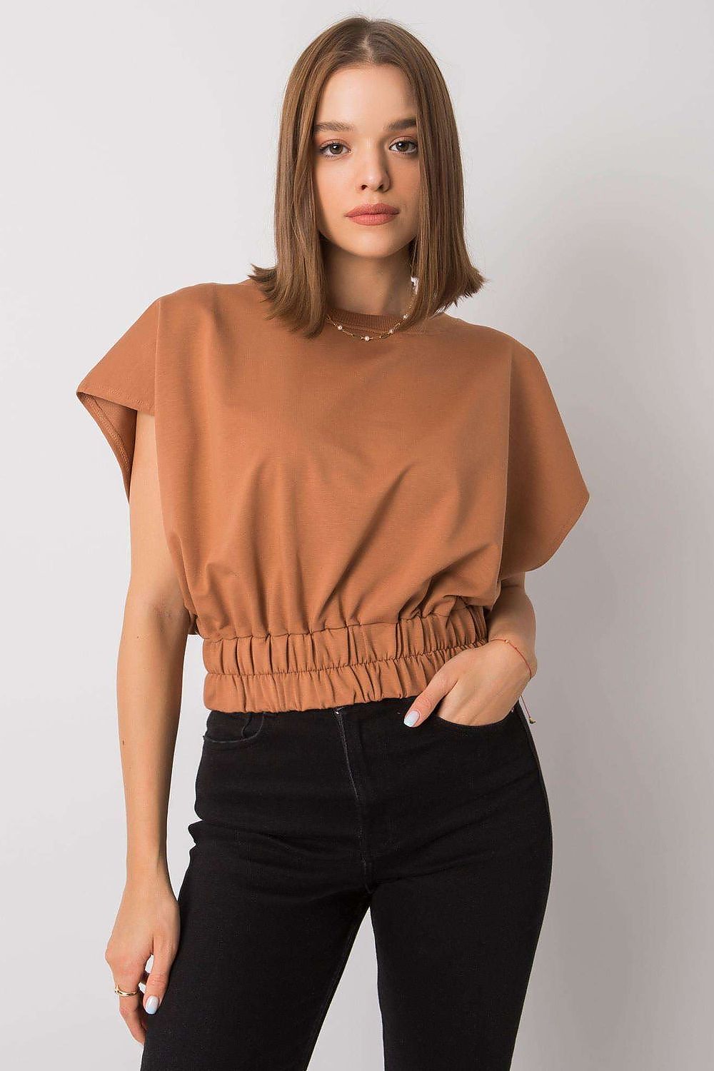 Luxury Ladies' Loose Fit Sweatshirt with Short Sleeves and Wide Rubber Band in brown, captured in a poised moment that highlights its comfortable fit and contemporary design.