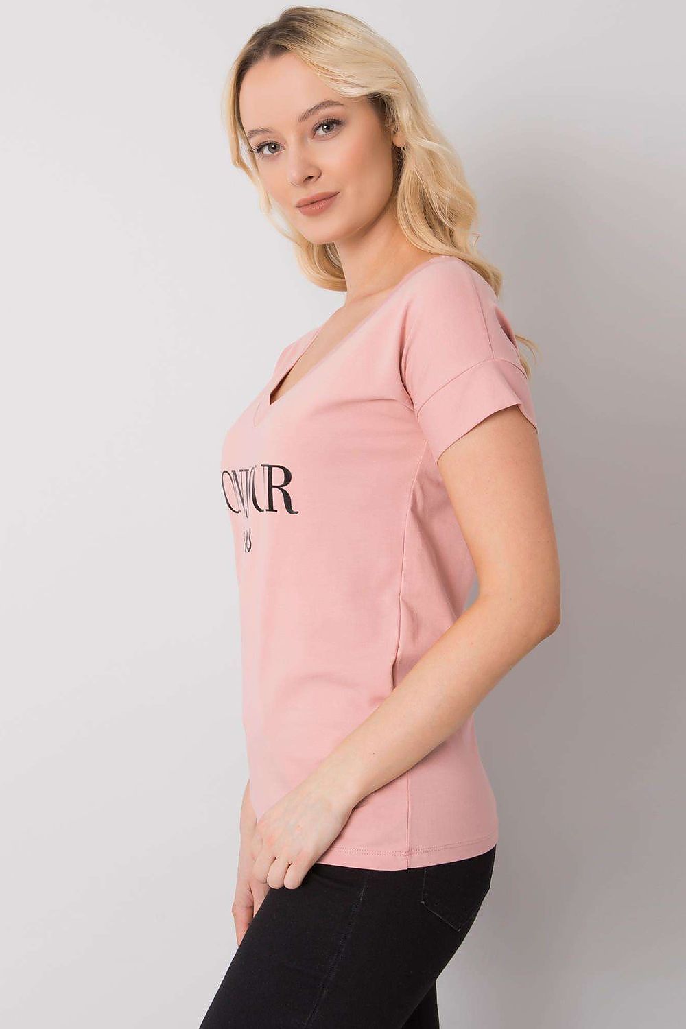 Elegant Women's V-Neck T-Shirt in Soft Cotton-Lycra Blend with Decorative Front Wording, side view on a model showcasing the stylish cut and design of the blush pink fabric.
