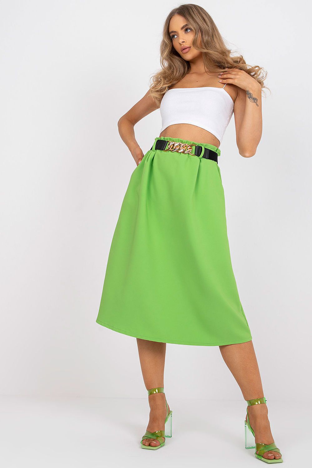 Elegant Italy Moda Skirt with Elastic Waistband, Side Pockets & Decorative Belt worn by a model in a sophisticated pose, paired with a white sleeveless top and fashionable green accessories.