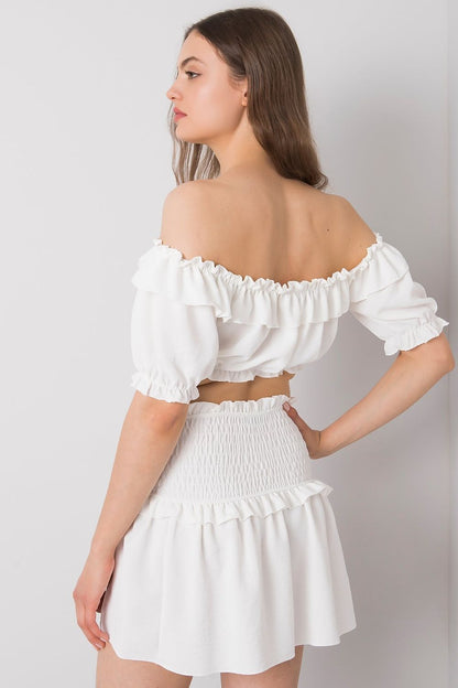 Och Bella Spanish Style Blouse with Tie Front and Short Sleeves - Elegant Polyester Top featuring a model in a back view to highlight the exquisite off-shoulder and ruffled features.