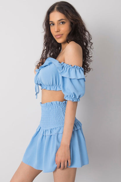 Och Bella Spanish Style Blouse with Tie Front and Short Sleeves - Elegant Polyester Top displayed on a model, highlighting its chic ruffled off-shoulder design and complemented by a matching skirt.