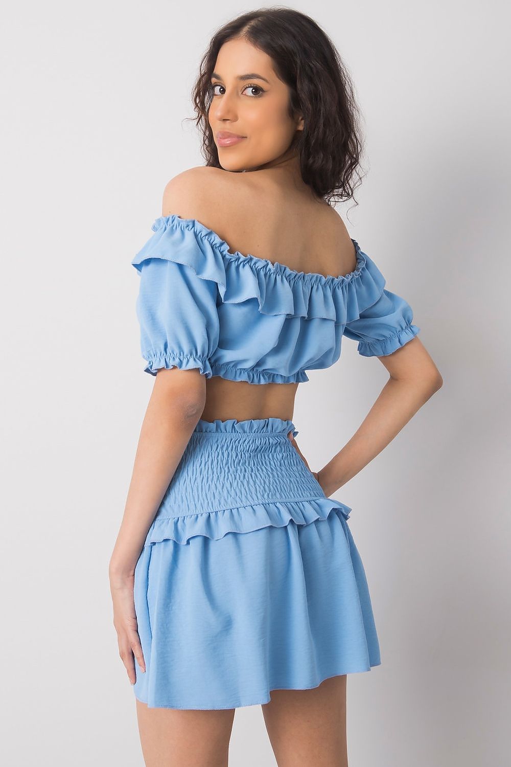 Och Bella Women's Short Summer Skirt with Wide Elastic Waistband in blue, styled with a matching cropped top, perfect for a chic summer look.