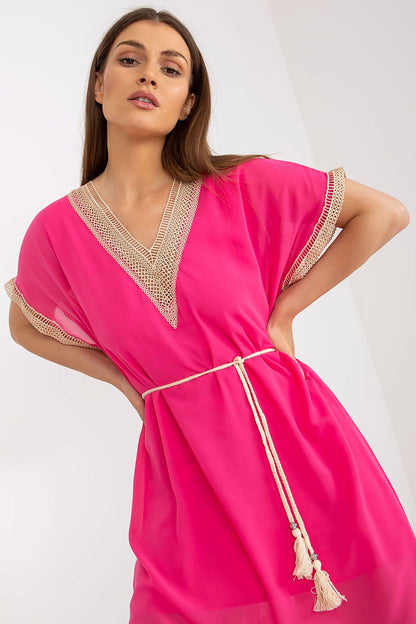 Chic and sophisticated, the Italy Moda Loose-Fitting Daydress in pink highlights a heart neckline and openwork accents, designed for elegant summer gatherings.