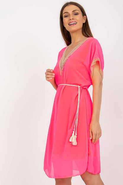 Italy Moda Loose-Fitting Daydress with Heart Neckline and Openwork Inserts, featuring a model wearing a vibrant pink dress, accentuated with delicate lace details for a luxurious summer look.