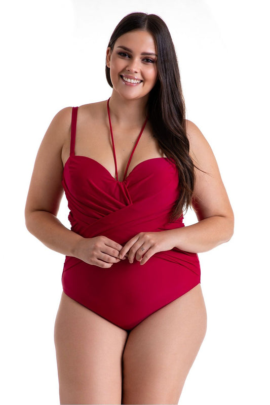 Luxury One-Piece Women's Swimsuit by Barontex featuring adjustable straps, optical slimming design, and stylish pleated detailing, modeled in a vibrant red on a confident woman.
