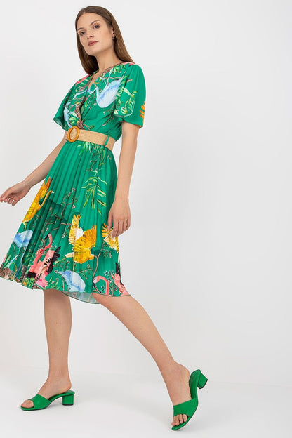 Elegant Summer Dress with Short Sleeves, Envelope Neckline and Braided Belt by Italy Moda - Model wearing a vibrant green floral dress with a braided belt, perfect for sophisticated summer occasions.
