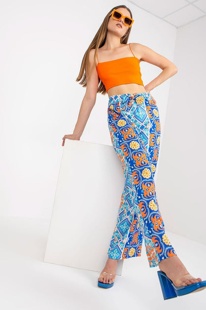 Italy Moda Women's High-Waisted Wide-Leg Trousers with Elastic Waistband - Elegant Comfort Pants displayed on a model with a modern pose, featuring an eye-catching blue and orange pattern, alongside a trendy orange crop top.