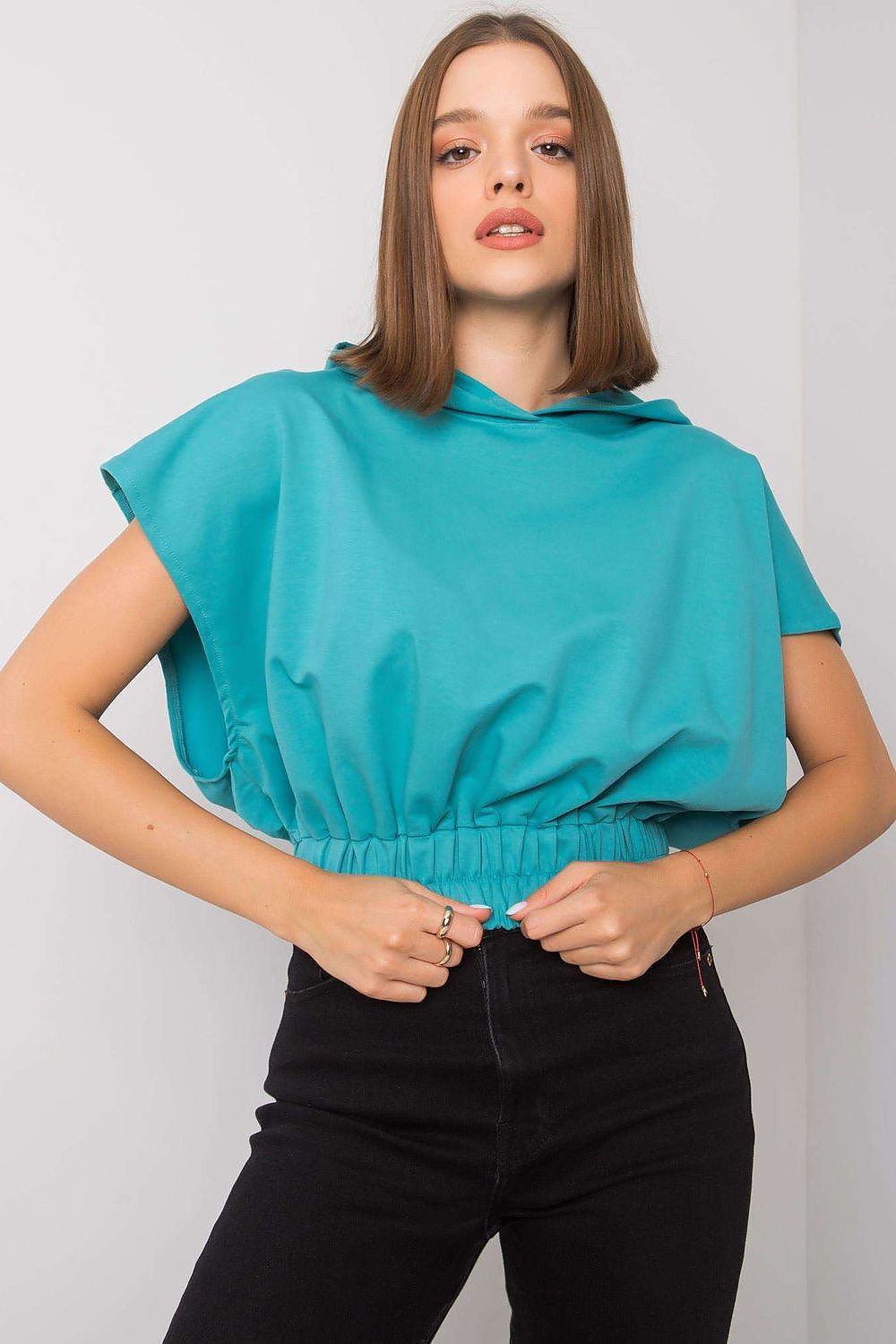 Ladies' Loose-Fit Sweatshirt with Short Sleeves and Hood, 65% Cotton Blend showcased on a model, featuring a stylish turquoise design and a relaxed silhouette, perfect for casual elegance.