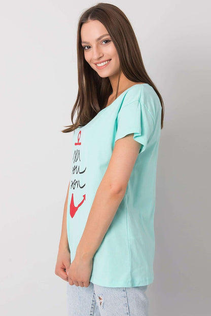 Fancy Ladies' Short Sleeve Cotton T-Shirt with Decorative Print - Round Neck Style, showcasing a side view of a light blue t-shirt embellished with an anchor artwork and playful text 'sea you soon' for a relaxed style.