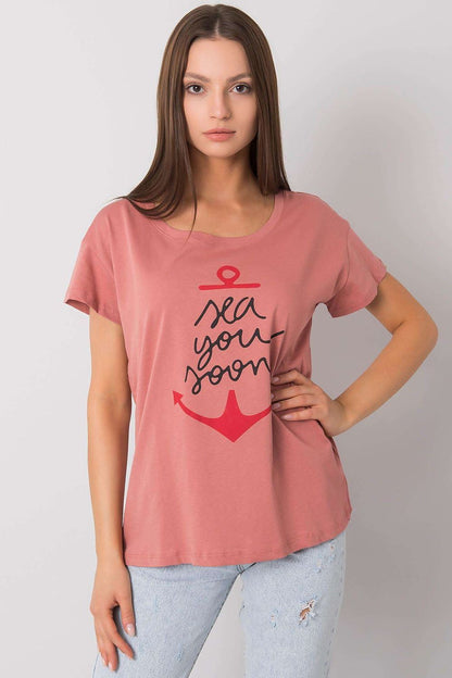 Fancy Ladies' Short Sleeve Cotton T-Shirt with Decorative Print - Round Neck Style, featuring a close-up view of a coral pink t-shirt adorned with an artistic anchor design and the playful 'sea you soon' message for a modern twist.