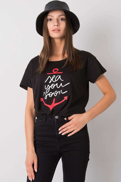 Fancy Ladies' Short Sleeve Cotton T-Shirt with Decorative Print - Round Neck Style in a classic black colour, expertly styled with an 'sea you soon' anchor motif, displayed on a sophisticated model.