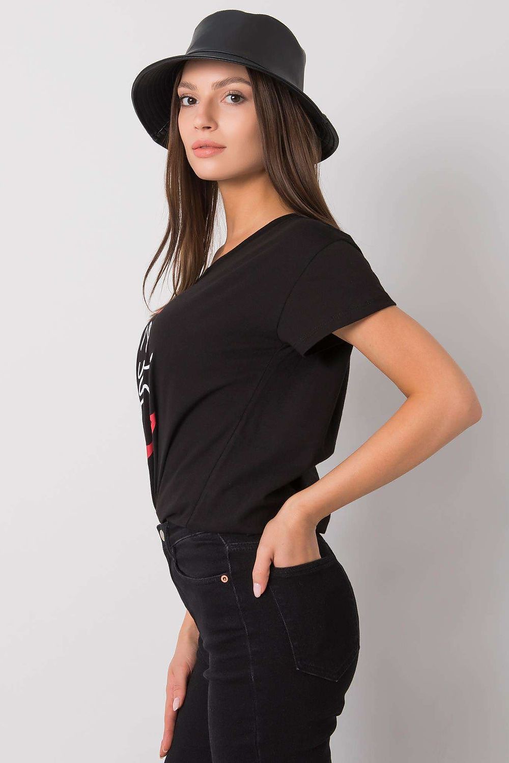 Fancy Ladies' Short Sleeve Cotton T-Shirt with Decorative Print - Round Neck Style, side view of model in a black t-shirt featuring a decorative print, complemented by sleek jeans and a fashionable bucket hat.