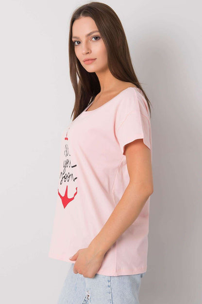Fancy Ladies' Short Sleeve Cotton T-Shirt with Decorative Print - Round Neck Style, model displaying a chic side profile in a pink t-shirt that features an artistic anchor design, embodying effortless style and comfort.