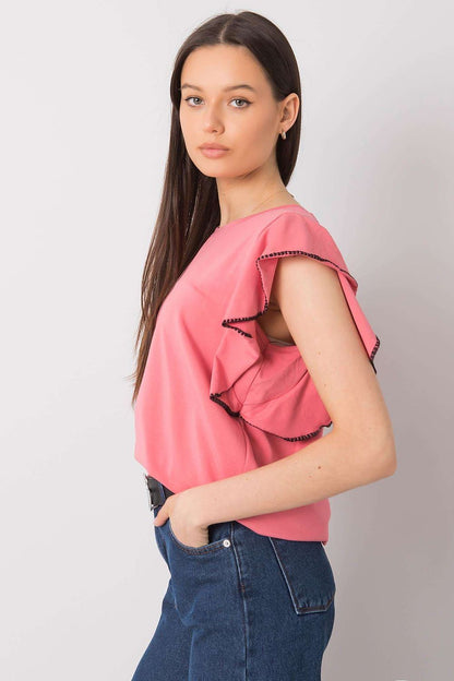 Elegant Frill Sleeve Cotton Blend Blouse with Round Neck – Versatile Everyday Wear, side view of a model in a pink frill sleeve blouse styled with denim trousers.