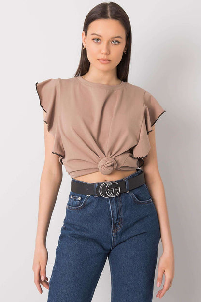 Elegant Frill Sleeve Cotton Blend Blouse with Round Neck - Model in a tied taupe blouse showcasing frill sleeves, merging fashion and elegance for casual occasions.