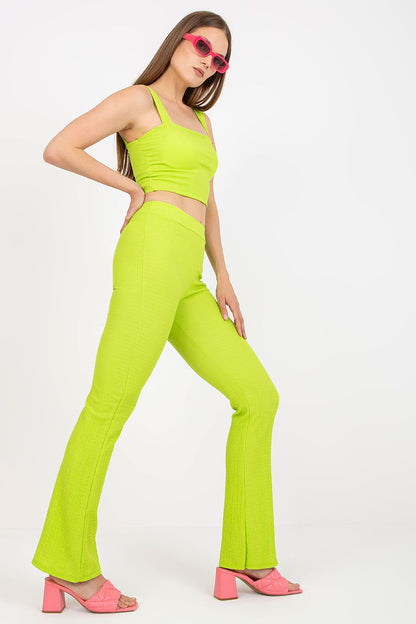 Italy Moda Women's Elegant Two-Piece Set showcasing a stylish lime green ensemble with a fitted short top and wide-leg pants, complemented by chic pink heeled sandals.