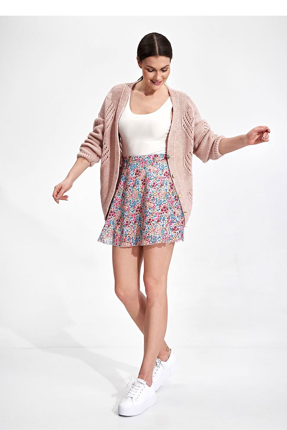 Flared Mini Skirt by Figl in a delightful floral print, styled with a luxurious knitted cardigan, offering a feminine silhouette that exudes charm and elegance for any casual occasion.