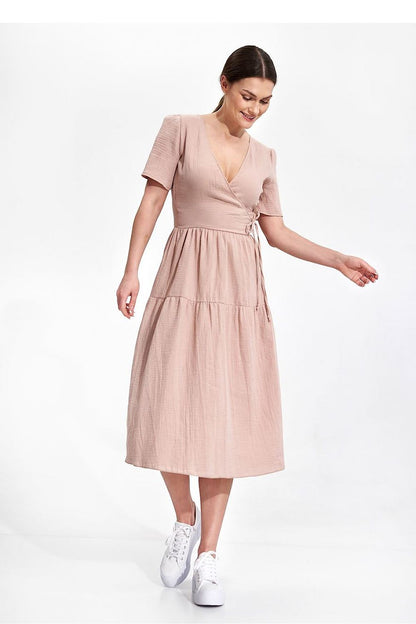 Elegant Figl Summer Midi Dress with Short Sleeves and Flared Cut in 100% Cotton, capturing a graceful moment in the soft pink fabric, exuding luxury and comfort.