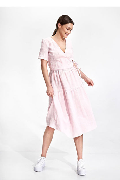 Elegant Figl Summer Midi Dress with Short Sleeves and Flared Cut in 100% Cotton, model wearing the dress in soft pink, showcasing its flattering envelope neckline and flared silhouette.