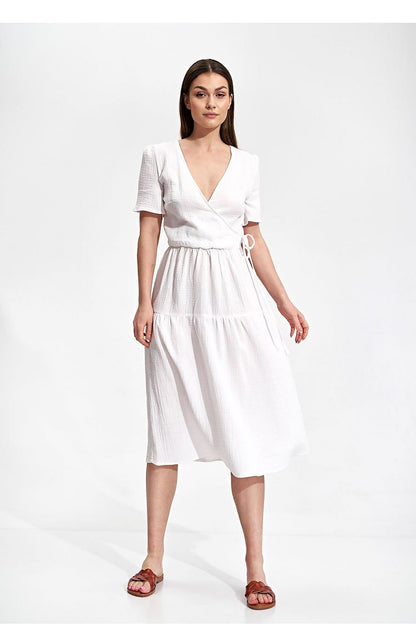Elegant Figl Summer Midi Dress with Short Sleeves and Flared Cut in 100% Cotton, model presenting the dress in pristine white, emphasising its chic design and comfortable fit.