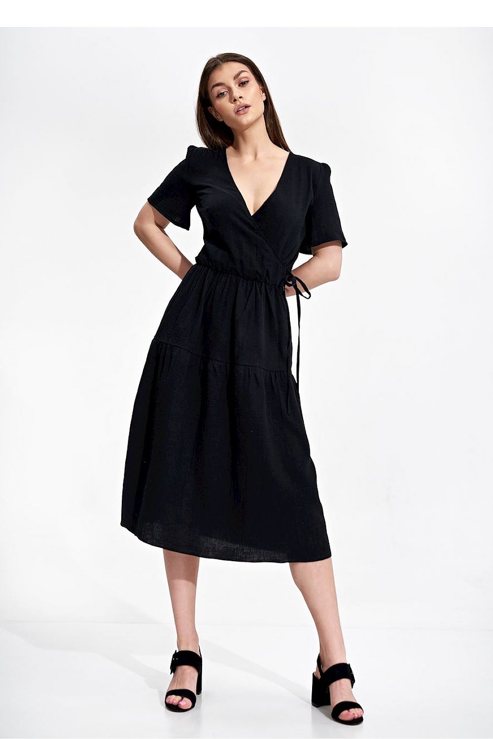Elegant Figl Summer Midi Dress with Short Sleeves and Flared Cut in 100% Cotton, showcasing a model in a stylish black dress with a flattering wrap cut and decorative side binding.