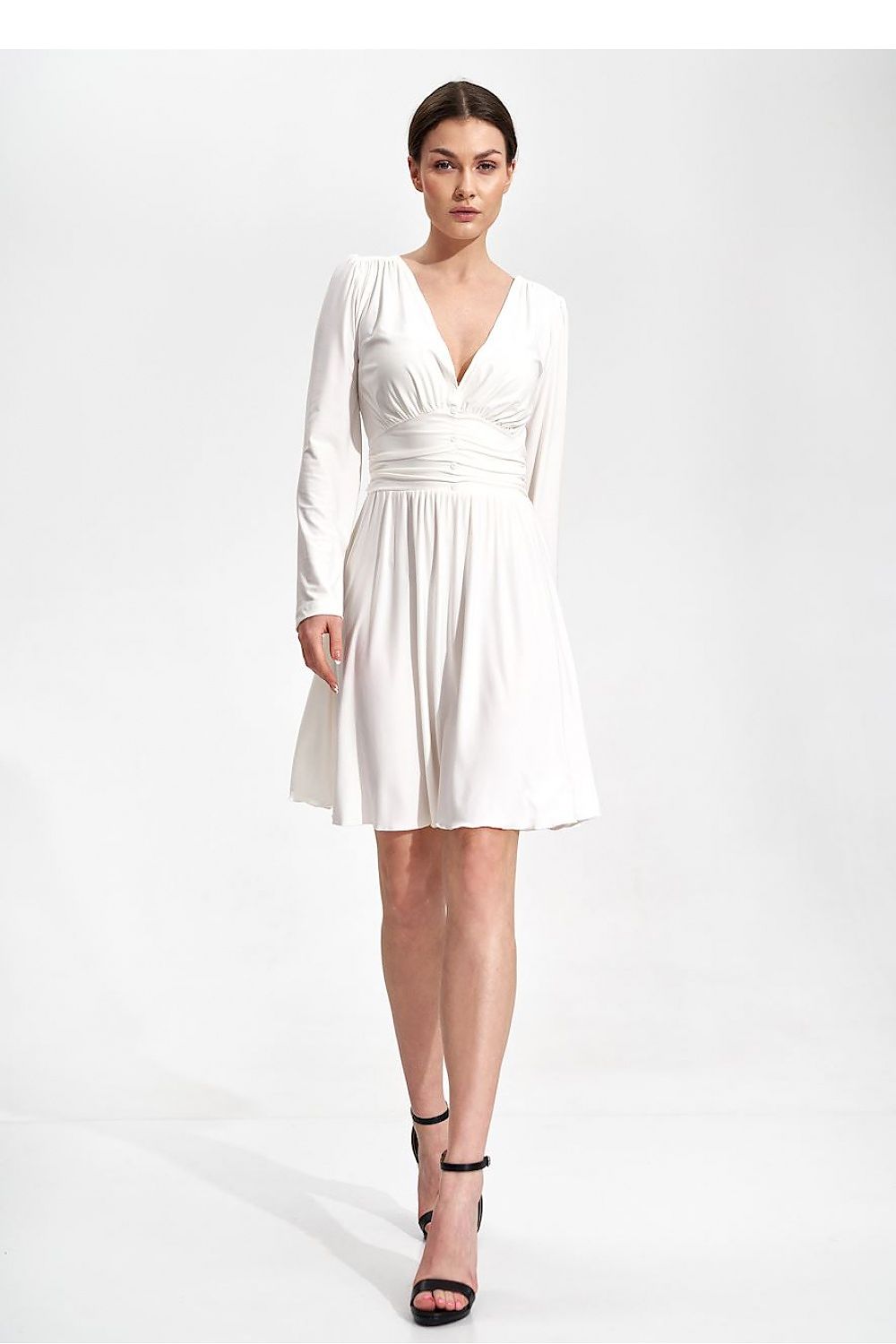 Elegant Flared Knee-Length Dress by Figl with Sweetheart Neckline and Draped Belt, showcasing a model in a white dress with long sleeves and a flattering fit.