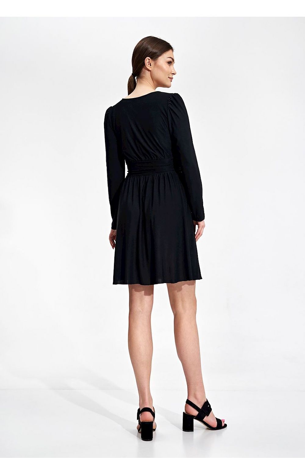 Back view of the black Elegant Flared Knee-Length Dress by Figl, illustrating the draped belt and short flared skirt for a sophisticated finish.