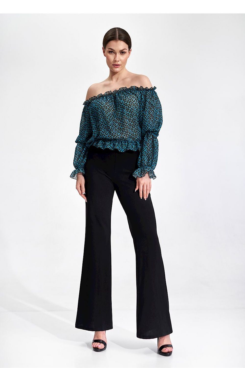 Elegantly Airy Figl Long Sleeve Blouse with Elastic Bands - Model wears a stunning blue leopard print off-shoulder blouse and black flared trousers, epitomizing luxurious style.