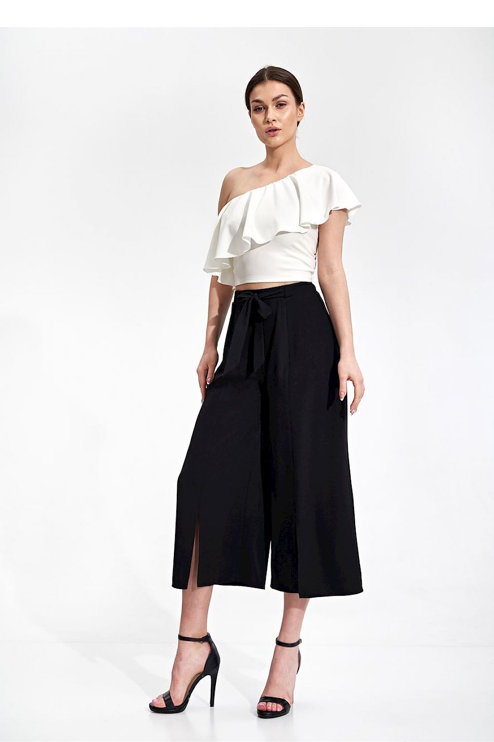 Luxury Figl One Shoulder Ruffle Crop Blouse, elegantly styled with black high-waisted trousers, emphasizing sophistication and modern fashion.