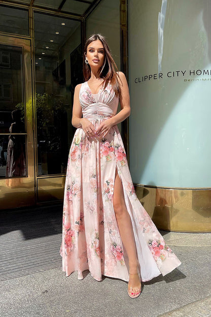 Elegant Floral Long Dress by Bicotone with Slit and Delicate Neckline for Summer Occasions, featuring a close-up of a model elegantly posing in a luxurious floral dress with a delicate neckline, ideal for summer celebrations.