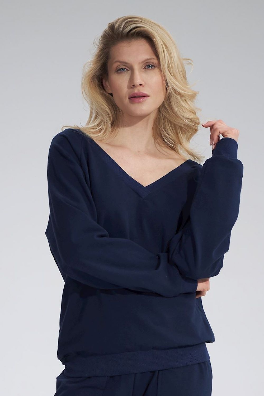 Luxury Cotton V-Neck Sweatshirt by Figl, featuring a stylish model wearing the navy sweatshirt with long sleeves and a relaxed fit, showcasing a sophisticated look.