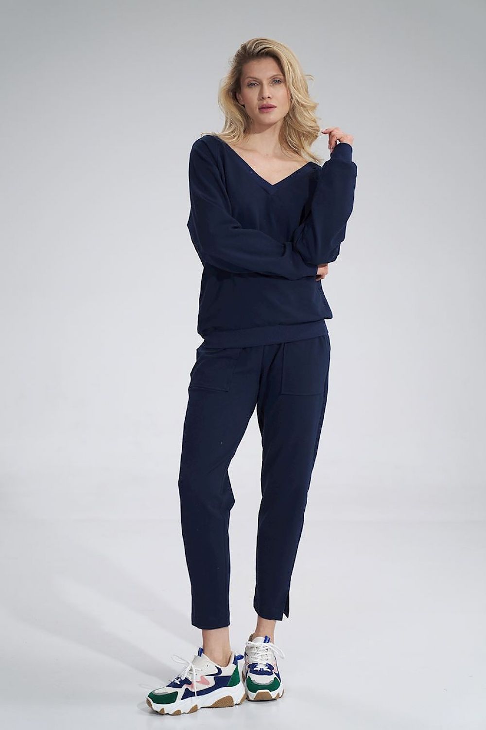 Luxury Cotton V-Neck Sweatshirt by Figl, shown on a model posing elegantly with a casual look alongside matching trousers and fashionable sneakers, encapsulating chic comfort.