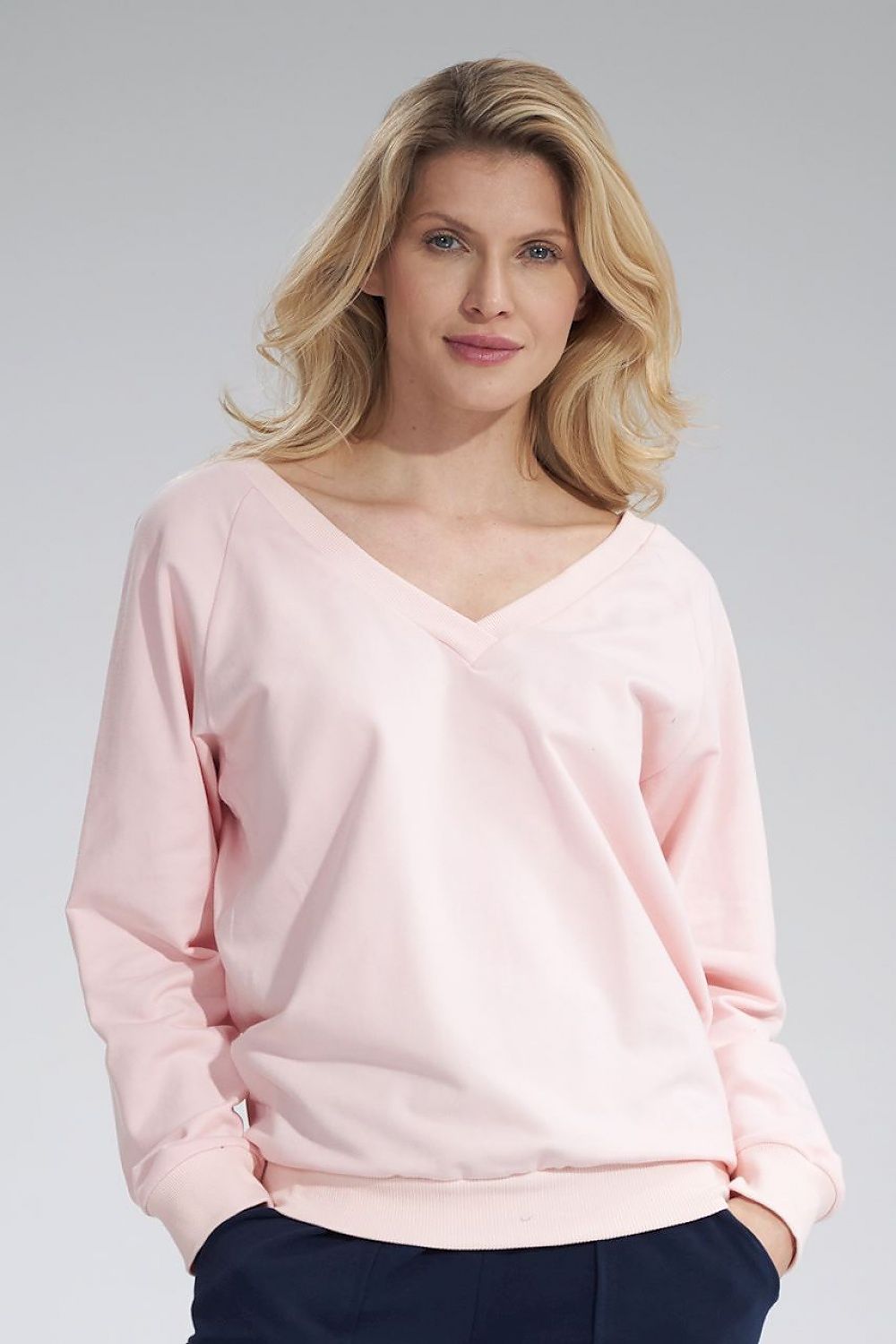Luxury Figl Cotton V-Neck Sweatshirt with Ribbed Hem and Decorative Ribbon, showcasing a stylish model wearing a soft pink cotton pullover with long sleeves.