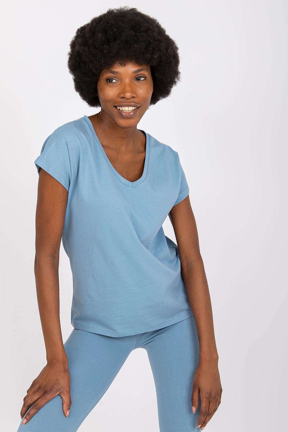 Elegant image of a model wearing the Luxury BFG Heart Neckline T-Shirt in a soft blue hue. This T-shirt features a sophisticated heart neckline and short sleeves, crafted from a soft cotton blend, providing a chic and comfortable look, perfect for any wardrobe.
