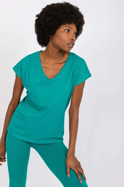 Luxury BFG Heart Neckline T-Shirt in vibrant turquoise, featuring a soft cotton blend and elegant cut, model showcasing a stylish pose. Available in sizes S to XL.
