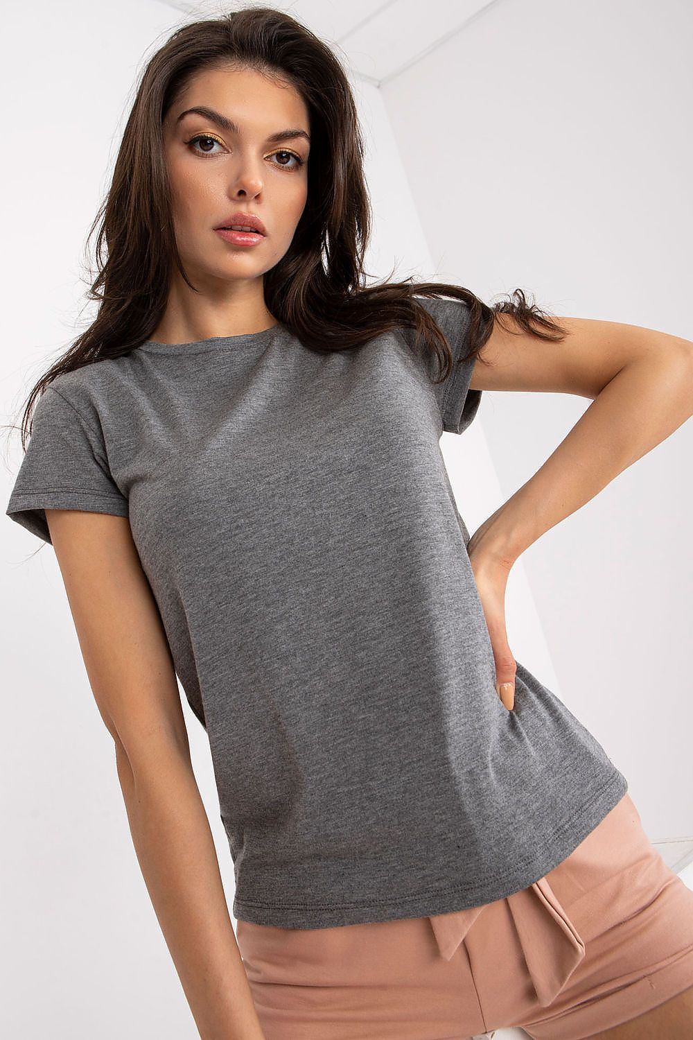 Luxury Ladies' Cotton Blend T-Shirt by BFG - Short Sleeve, Round Neck, Everyday Comfort. Model highlighting the elegant fit of a grey t-shirt with subtle confidence.