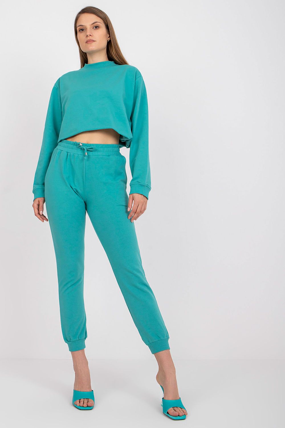 BFG High Rise Tracksuit Trousers with Drawstring Waist and Side Slash Pockets, model showcasing a luxurious turquoise athleisure look, perfect for comfort and style.